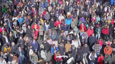 Large crowd marching in protest view from above, top view Stock Footage 234814828