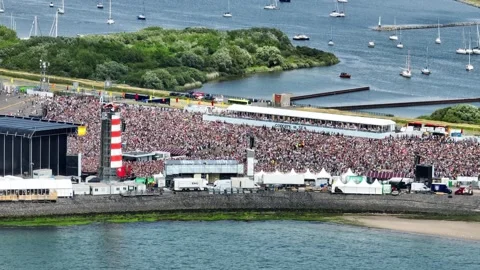 Large crowd of people attend popular summer event in Netherlands, Concert Stock Footage 219001143