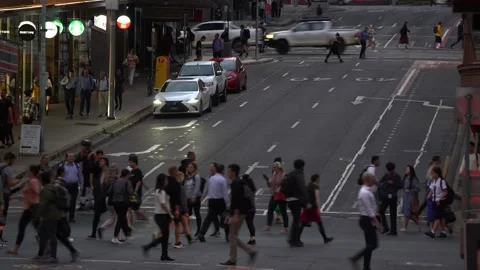 Large crowd of people crossing at the intersection between Adelaide and Stock Footage 220541029