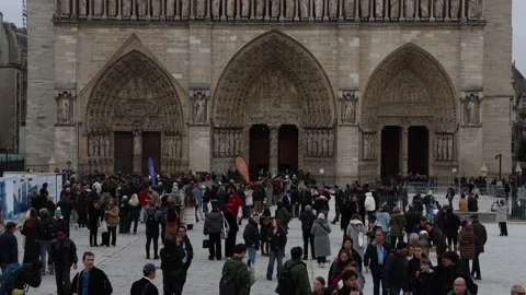 Large crowd of people in front of Notre Dame cathedral in Paris. Stock Footage 333498894
