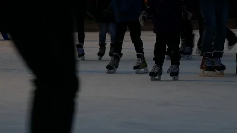 Large crowd of people ice skating in different directions - shot from waist down Video stock 69723466