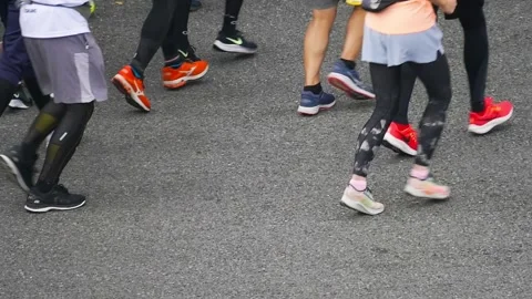 Large crowd of people running marathon race, health lifestyle, jogging. Low angl Stock Footage 238974538