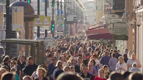 A large crowd of people walking along Nevsky Prospect on a warm sunny Sunday Stock-Footage 146978375