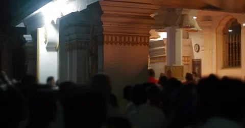 A large crowd of pilgrims bypass the Buddhist temple Stock Footage 85286739