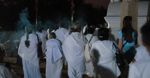 A large crowd of pilgrims bypass the Buddhist temple Stock Footage 85286872