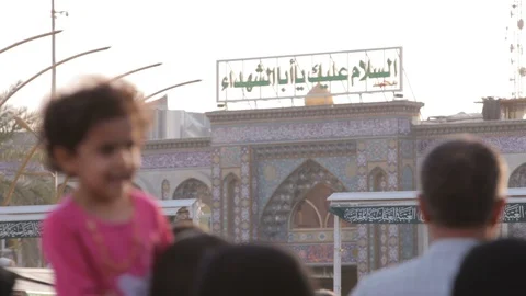 Large crowd of pilgrims in front of Imam Hussein's Shrine, Karbala Video stock 119676072