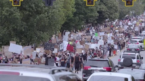 Large crowd of protestors marching with signs ATL 50p HD h264 Stock Footage 137473017