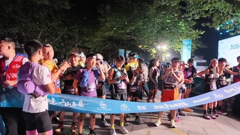 Large Crowd of Runners Waiting Behind Blue Start Tape, Lushan Stock Footage 346701994