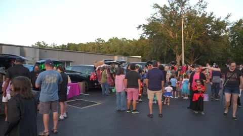 Large Crowd at School Trunk-Or-Treat Festival Stock Footage 318109647