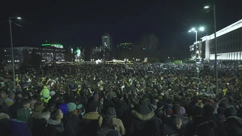 A large crowd of thousands of people protest against the state mafia in downtown Stock Footage 324557092