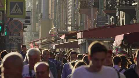A large crowd walking along Nevsky Prospect with old buildings on a sunny day Stock-Footage 146978854