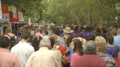 Large crowd walking around parade Stock Footage 104888123