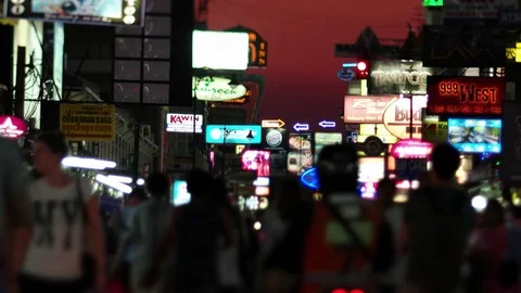 Large crowds of pedestrians, commuters, and shoppers cross the famous Khao San Stock Footage 80473247