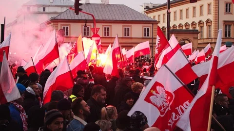 Large Crowds With Polish Flags And Flares Walking On Street Celebrating Stock-Footage 122259974