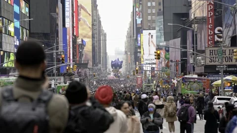 Large crowds walking towards Times Square after Thanksgiving Parade in NYC Stock Footage 200776828
