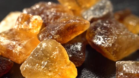 Large crystals of natural cane sugar . Brown lump caramelized, close-up. Stock Footage 101031803