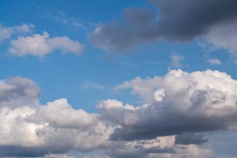A large cumulus cloud can be seen in the blue sky. Close-up Stock Photos