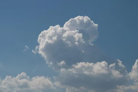 Large cumulus cloud formation against clear blue sky Photos