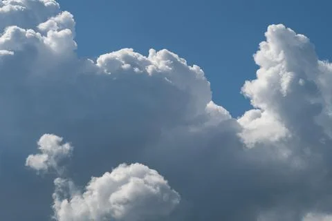 Large cumulus cloud formations against blue sky Photos