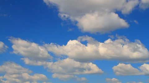 Large cumulus clouds against the blue sky Stock Footage 30303427