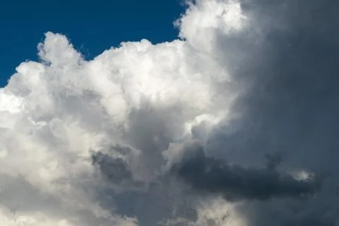 Large Cumulus clouds and dark rain clouds. Stock-Fotos