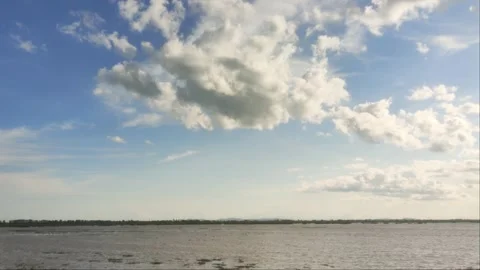 Large Cumulus Clouds Over Wide River And Flooded Plain In Rural Cambodia Stock Footage 341685263