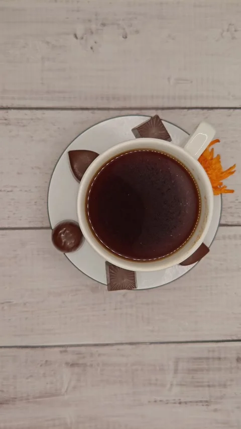 Large cup of coffee on a saucer, top view Stock Footage 329939112