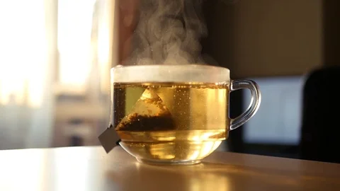 A large cup of invigorating black tea with steam. HD, 1920x1080, slow motion Stock Footage 123368805