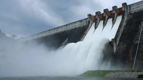 A large dam is draining because of heavy rain. The amount of water in the dam Stock Footage 141993045