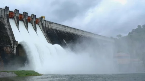 A large dam is draining because of heavy rain. The amount of water in the dam Stock Footage 142007991