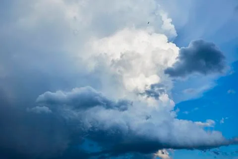 A large dark cloud against the blue sky Stock Photos