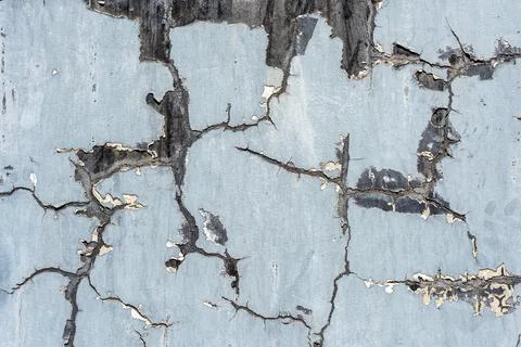 Large dark cracks on a light-colored wall Stock Photos