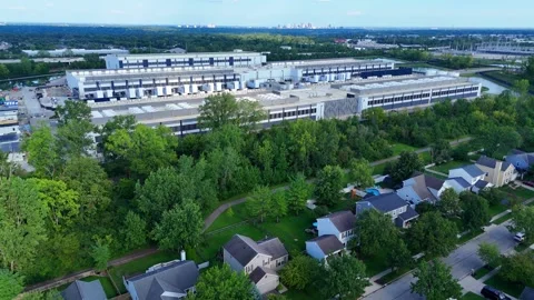 Large data center building complex next to a residential area with the city in Video stock 346148277