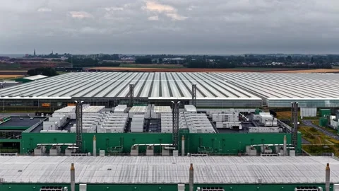 Large data center campus with green cooling units rising drone shot Video stock 346581583