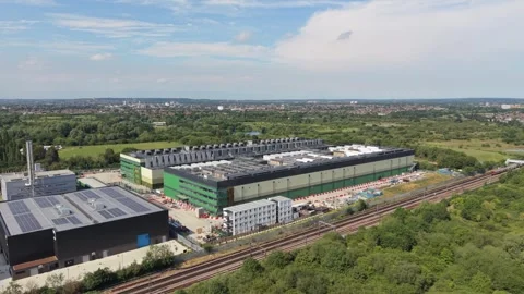 Large Data Center Construction Site Next to Railway Lines on a Sunny Day Stock Footage 339645428