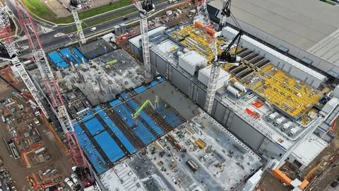 Large data centre industrial facility building constructing process aerial view Stock Photos