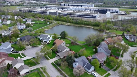 Large data computing facility standing near houses, showing impact on Stock Footage 336758548