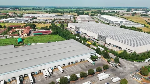 Large datacenter and logistics warehouse complex with trucks loading and Stock Footage 341449392