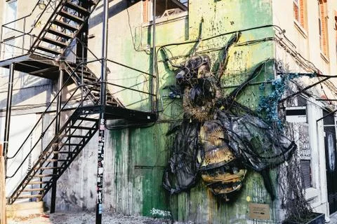 Large decorative bee artwork on an exterior wall Stock Photos