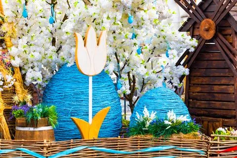 Large decorative Easter egg on a city street. Stock Photos