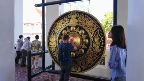 Large decorative gong inside Wat Arun Thai temple in Bangkok Thailand Stock Footage 337757954