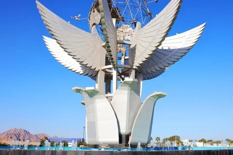 Large decorative monument featuring winged architectural elements Stock Photos