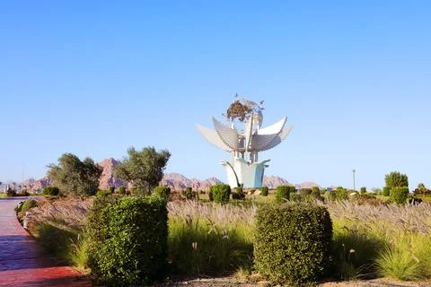 Large decorative monument featuring winged architectural elements Stock Photos