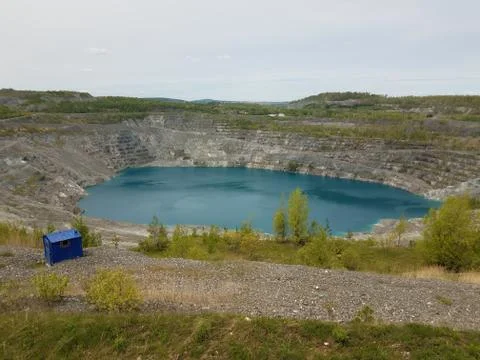 Large deep blue lake where asbestos was mined in Canada Stock Photos