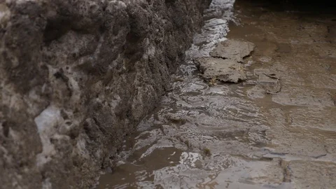 Large deep spring puddle on the road Stock Footage 90356430