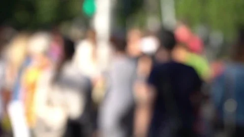 Large defocused crowd of pedestrians wearing bright clothes Stock Footage 116984873