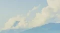 Large dense clouds forming high in mountains, timelapse of weather changes HD Footage