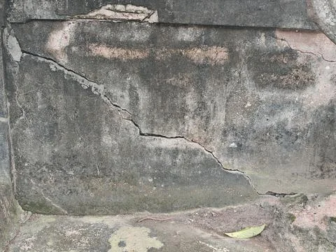 Large Diagonal Crack in Old Weathered Concrete Wall Stock Photos