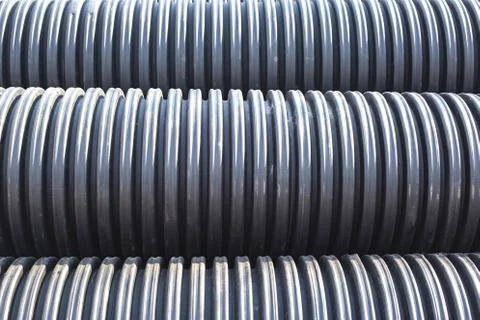 Large diameter black polypropylene pipes for laying communications, drainage Foto stock