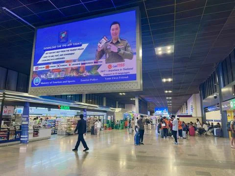 Large digital advertising screen introducing the Thailand tourist support app Stock Photos